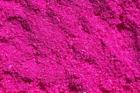 Texture of pink kietic sand for children playing with white and dark areasの写真素材