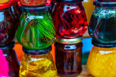 Homemade jam from healthy and healing herbs and fruits of coniferous trees. Multi-colored in glass jars.の写真素材