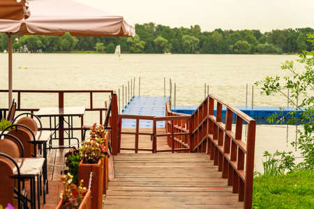 Exit to the pier to the lake from the coastal cafe.