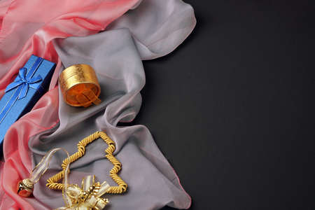 Provision. Festive attributes lie on the fabric of delicate pink and gray colors. Nearby is a...