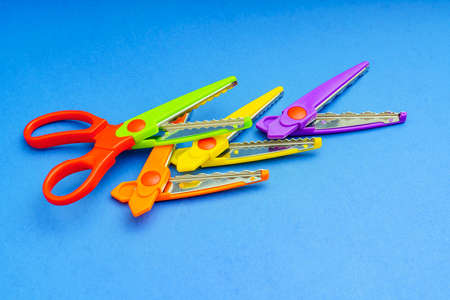 Scissors with colorful replaceable blades for curly cutting.の写真素材
