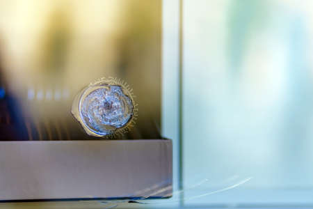 Round bullet impact mark on armored laminated glassの写真素材