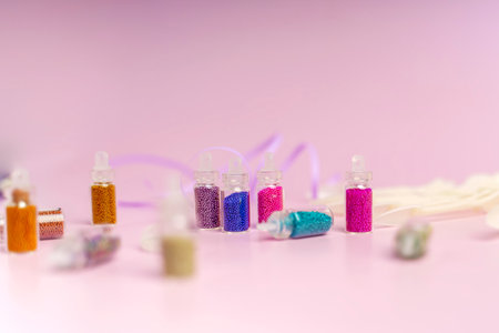 Manicure broths of different colors in small bottlesの写真素材