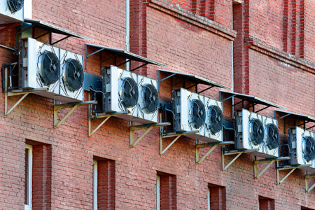 Brick wall with a range of large air conditioners