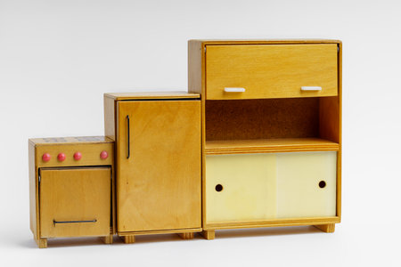 A set of vintage toy furniture made of wood on a light backgroundの写真素材