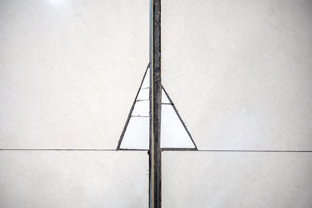 Cracks on the floor tile in the form of a Christmas treeの写真素材