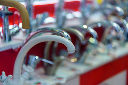 A range of water taps one of which is ceramicの写真素材