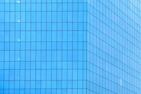 blue glass building made of rectangular glassの写真素材