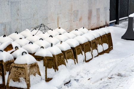 Specific blocks to restrict traffic stand in several rows under the snowの写真素材