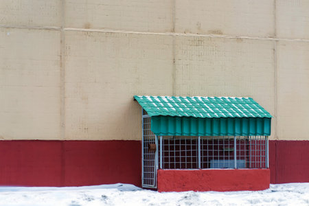 The entrance to the basement of an apartment building is closed with a lock grateの写真素材