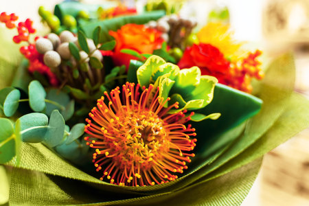 The bouquet is built around the main flower leucospermumの写真素材