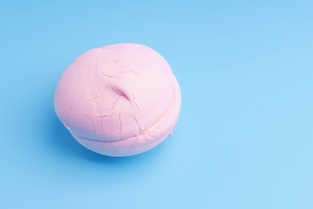 Pink round marshmallow marshmallow on a blue backgroundの写真素材