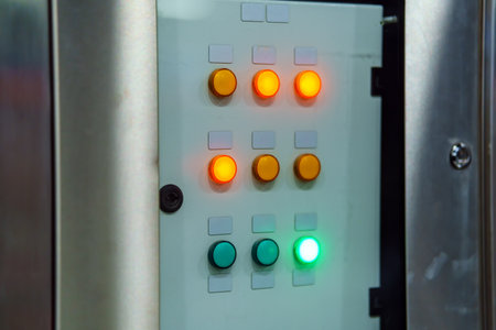 Orange and green buttons glow on the remote control