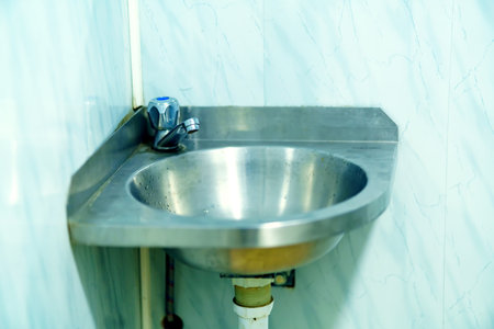 Metal dirty sink in a public toilet. unsanitary conditions.の写真素材