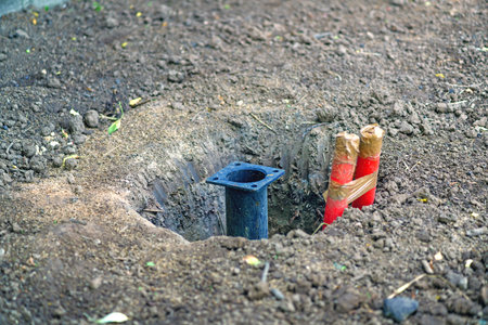 The basis for the installation of a pole with wires in the groundの写真素材