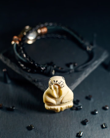 Amulet in the shape of a walrus figurine made of walrus tusksの写真素材