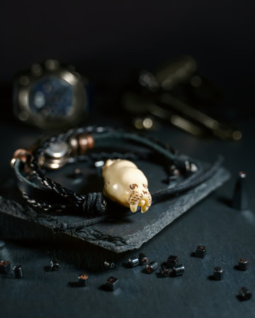 An amulet in the shape of a walrus head made of walrus tusk boneの写真素材