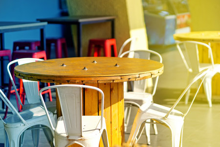 The table in the cafe is made of a large wooden wire spool