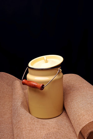Old enamel milk can yellow color