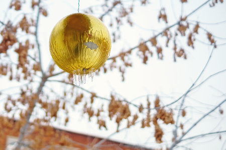 The ball for the celebration is covered with ice and iciclesの写真素材