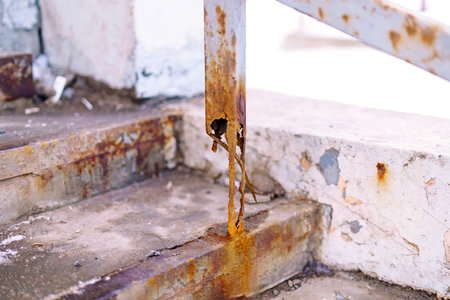 The metal support beam is completely corrodedの写真素材