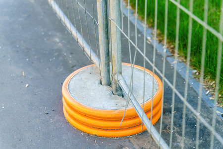 Concrete circle base for installing temporary fence metal postsの写真素材