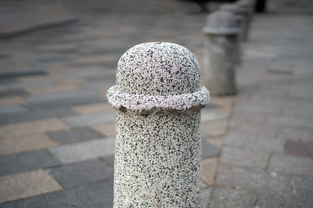 Concrete pillar with a semicircular cap and a skirt base