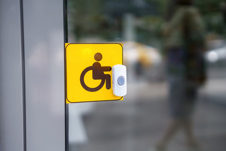 An accessible call button with a sign for individuals with special needs, promoting inclusivityの写真素材
