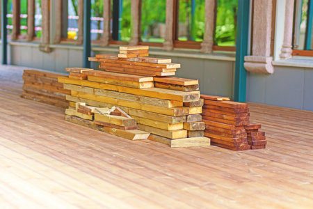 various wooden boards are lying on a wooden floor for repair purposes