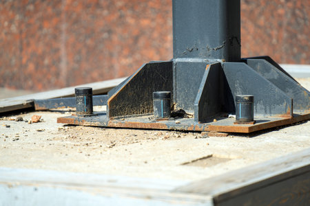 plastic caps on large bolts serve as protective barriers against rust on metal structures, ensuring durability and longevity in various environmental conditionsの写真素材