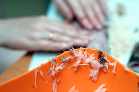 juxtaposition of culinary tradition and artistry, showcasing fish bones affixed cup rim. unique decoration celebrates the process of fish cleaning and emphasizes creativity in everyday lifeの写真素材