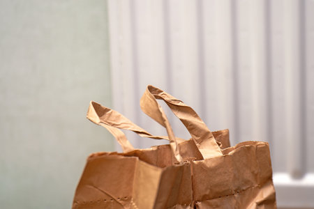 top section of an eco-friendly paper bag designed for potatoes, featuring sturdy handles and a rustic texture, perfect for sustainable packagingの写真素材