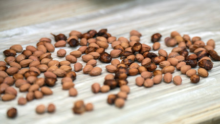 Washed cherry pits drying on a plastic bag for crafting eco-friendly children's toys and sensory...