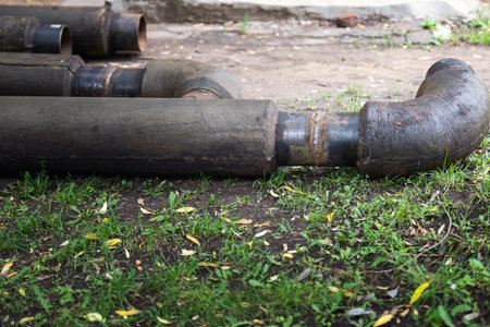 Welded metal pipes with concrete insulation for steam heating and hot water supply.