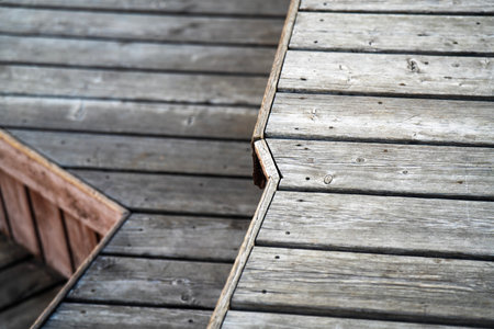 Multi-level wooden benches with jagged, broken-line edges in modern design.