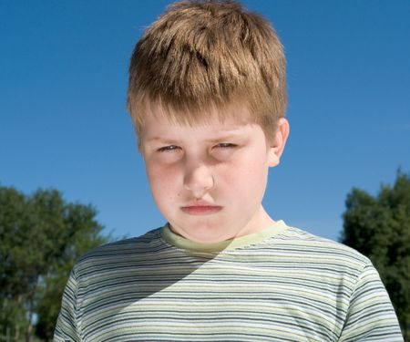 little boy. sad eyes. sad faceの写真素材
