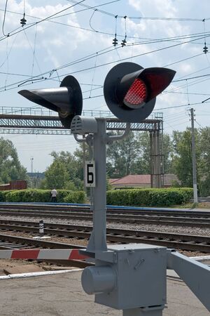 Summer. The railway. A semaphore. A red signal.の写真素材
