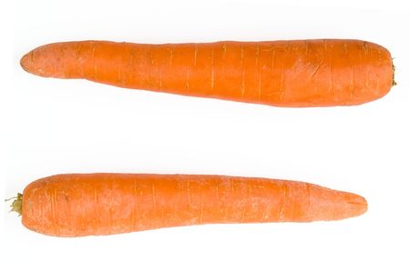 equal sign. fresh orange carrot on a white backgroundの写真素材
