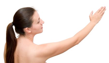 The young woman has stretched a hand on a white backgroundの写真素材
