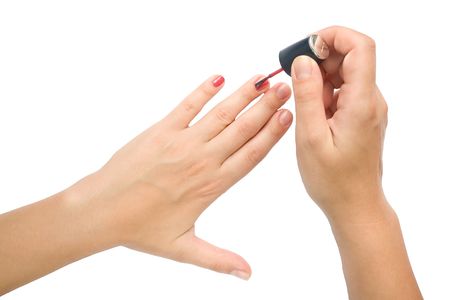 Manicure preparation. Female hands make manicure.の写真素材