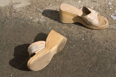 a dilapidated pair of woman's shoesの写真素材