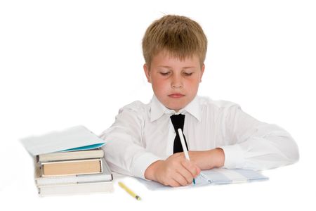 a young boy studying his homeworkの写真素材