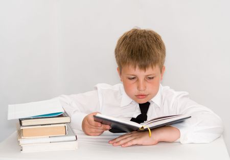 a young boy studying his homeworkの写真素材