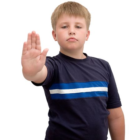 Image of young boy with hand outstretched, warding off any unwelcome situationsの写真素材