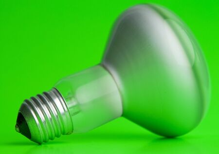 the electric bulb on a green backgroundの写真素材