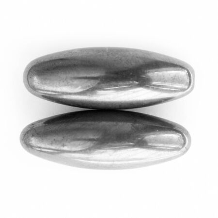 Abstraction. Two brilliant polished minerals &#8211; magnets.の写真素材