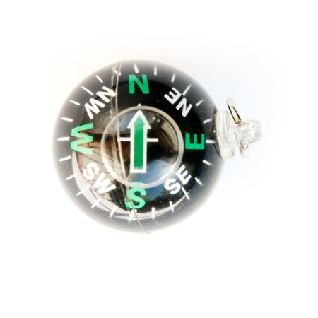 Small black compass on a white backgroundの写真素材