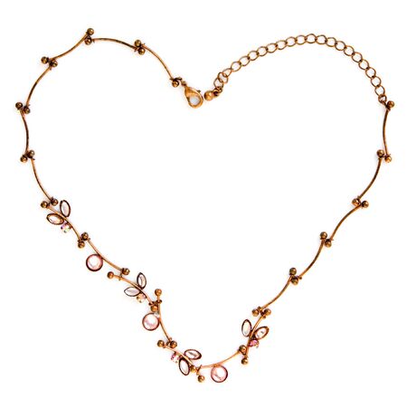 necklace in the shape of a heart on a white backgroundの写真素材