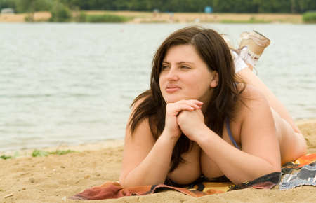 The young beautiful woman on a beachの写真素材