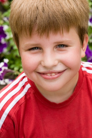 Portrait of a boy with a pleased smile upon one's faceの写真素材